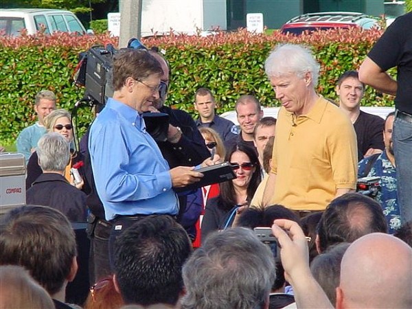 Bill Gates signs off Windows XP gold master, Aug. 24, 2001. A helicopter waits to fly off the code. [Ari Pernick]